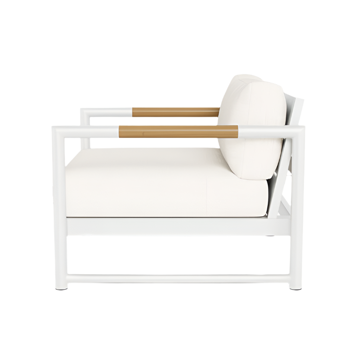 Side view of the HARBOUR OUTDOOR Breeze XL Lounge Chair in White Panama Blanco, featuring a white cushion, aluminum frame, and light brown solid teak armrest accents.