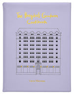 The Bergdorf Goodman Cookbook, Leather Bound" by Graphic Image is a luxury lavender cookbook featuring the iconic building's line drawing on its cover and includes favorite BG restaurant recipes.