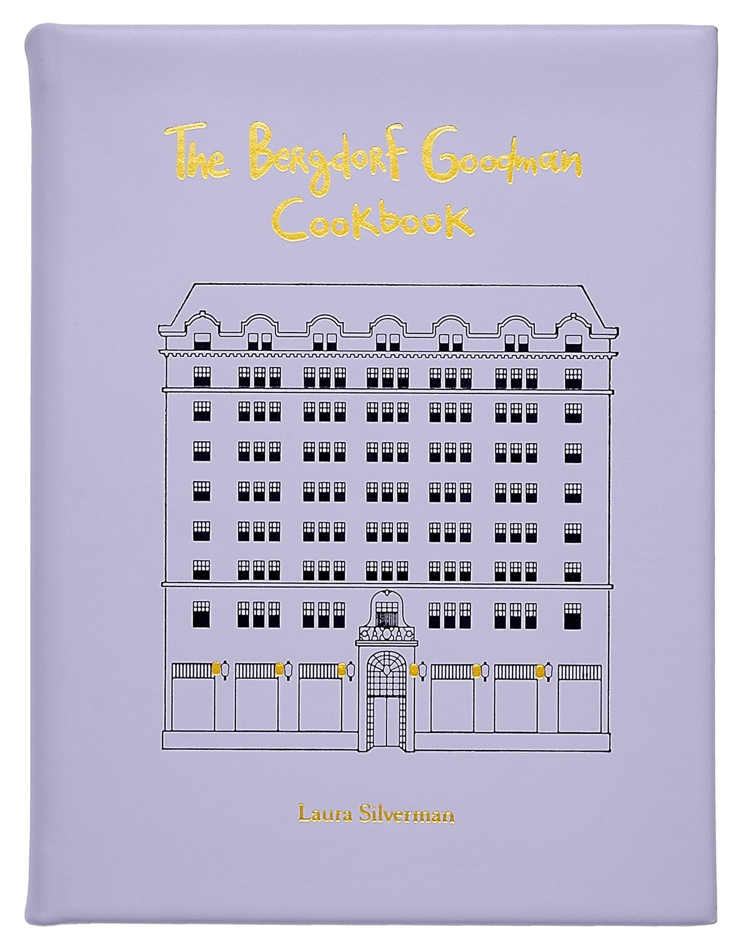 The Bergdorf Goodman Cookbook, Leather Bound" by Graphic Image is a luxury lavender cookbook featuring the iconic building's line drawing on its cover and includes favorite BG restaurant recipes.