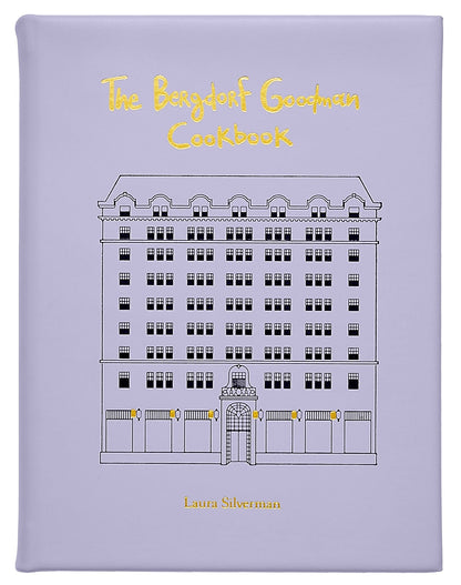 The Bergdorf Goodman Cookbook, Leather Bound" by Graphic Image is a luxury lavender cookbook featuring the iconic building's line drawing on its cover and includes favorite BG restaurant recipes.
