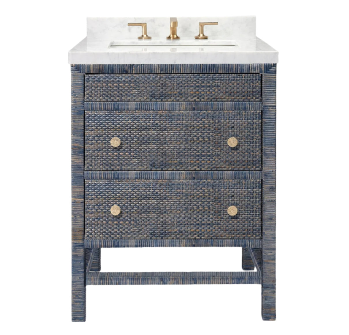 The Isla Vanity Collection by Made Goods features a blue textured rattan freestanding vanity with two drawers, gold knobs, a white countertop, and gold faucet fixtures for a stylish bathroom upgrade.