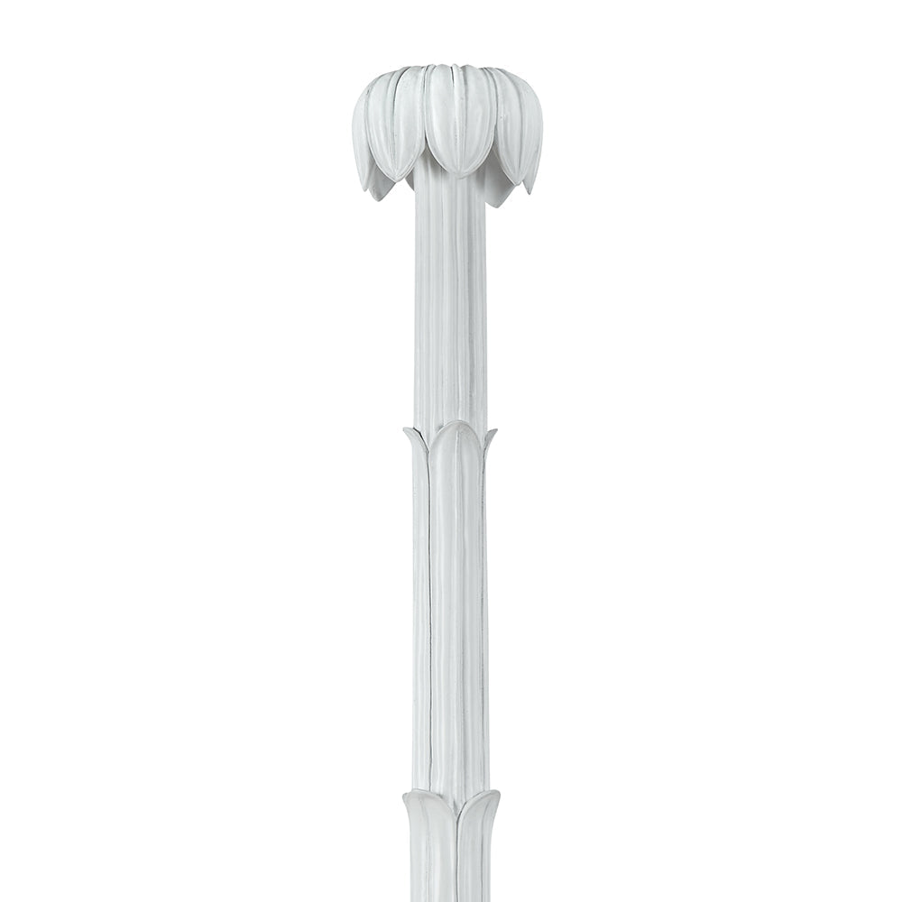 The Keller Bed by Bunny Williams features a white, vertical column with a fluted shaft and a capital adorned with stylized carved leaves, reflecting Hollywood Regency elegance and ornate detailing.