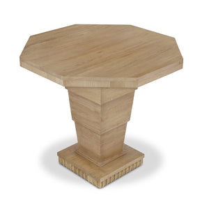 The Burton Side Table by Bunny Williams features an octagonal oak top and a tiered geometric pedestal base, shown against a white background.