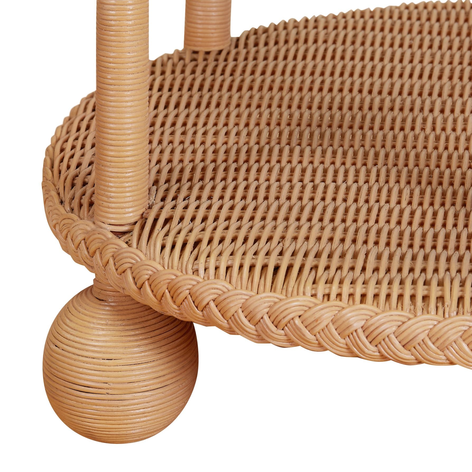 Close-up of the Lucas Drinks Table by Bunny Williams, featuring a woven rattan shelf with rounded legs and braided edge detail, showcasing the charm of classic American furniture.
