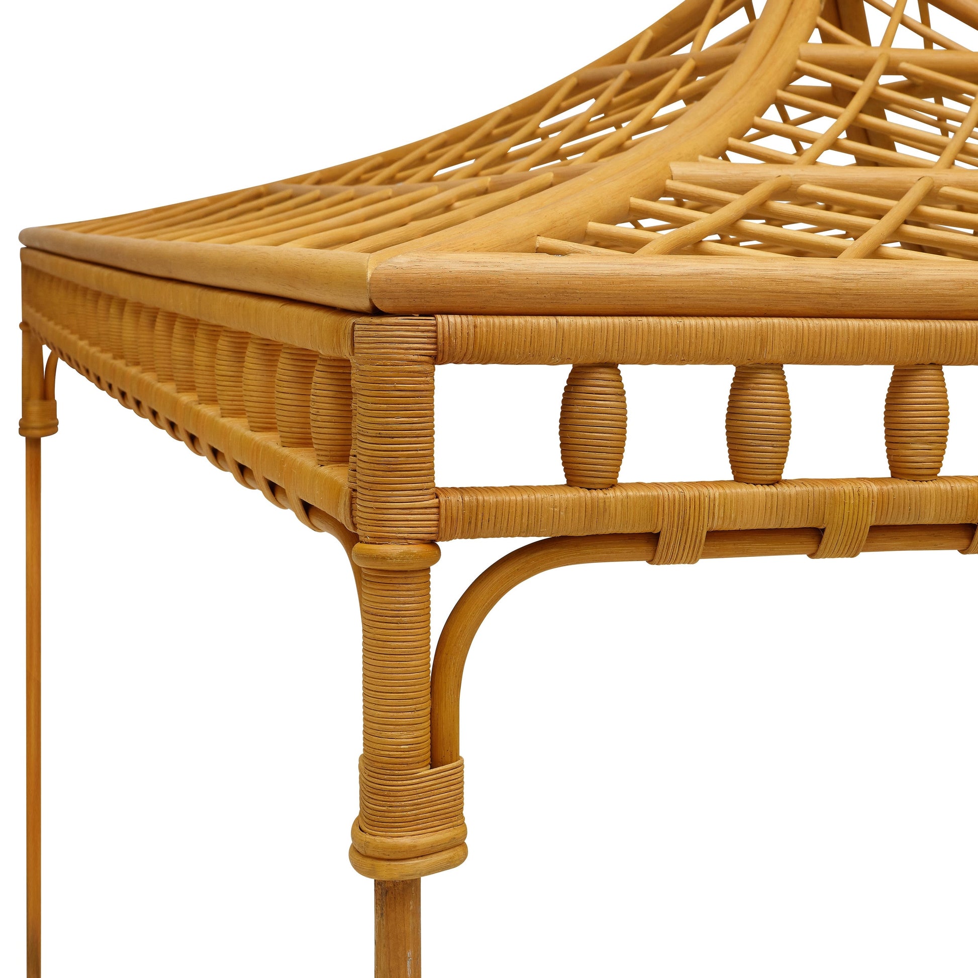 Close-up of the Bunny Williams Rattan Trellis Canopy Bed, showcasing its intricate lattice weaving, rounded edges, and natural wood finish.