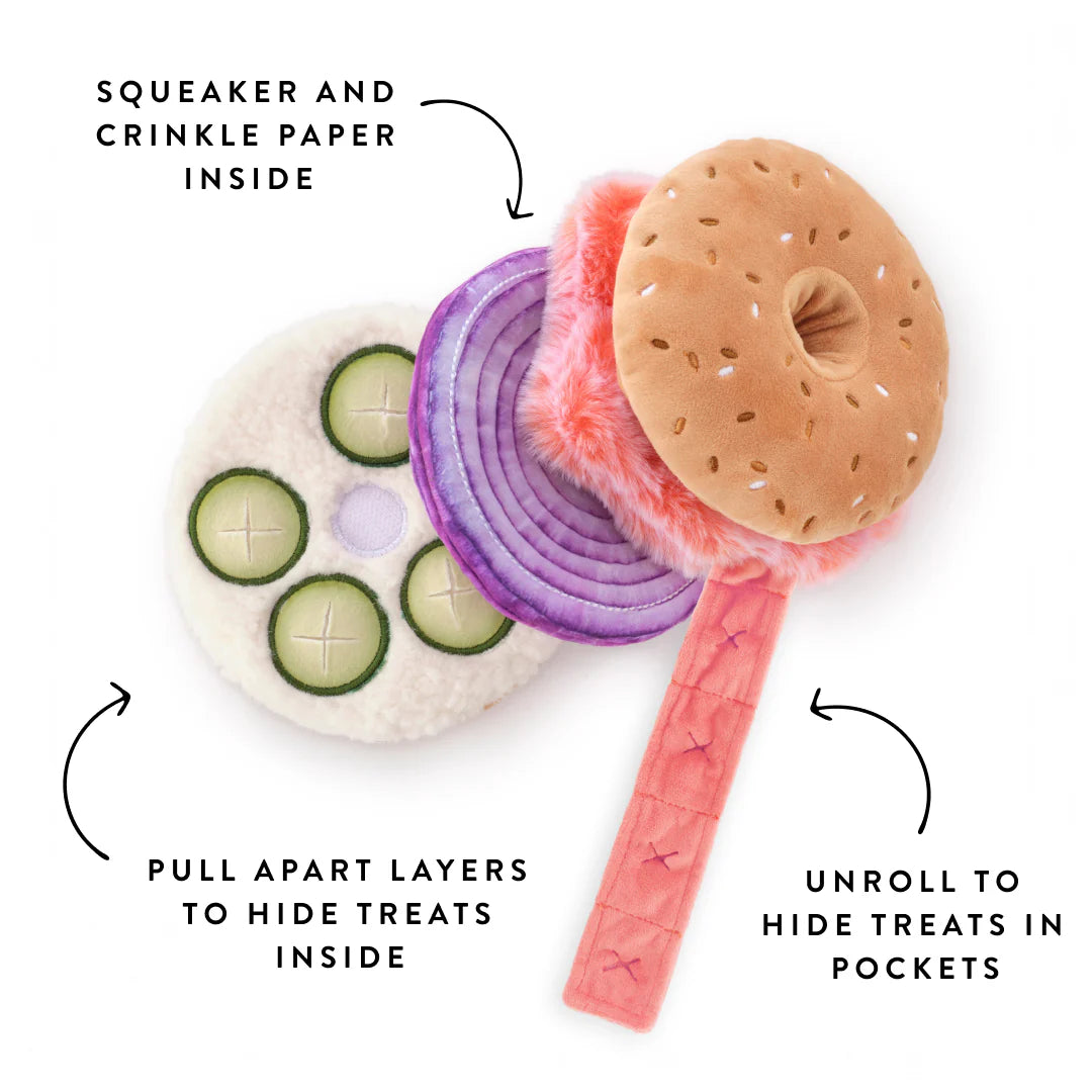 The Foggy Dog Bagel and Lox Interactive Dog Toy features pull-apart layers, crinkle and squeak sounds, and hidden treat pockets for extra canine fun.