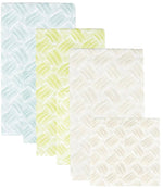 Four pastel, patterned rugs in various sizes, plus one square rug, overlap in a chic display—an ideal match for Caspari’s Basketry Napkin Collection at your next gathering.