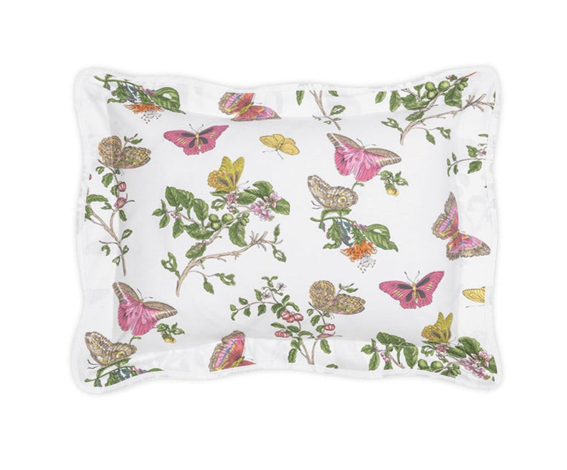The Baudin Butterfly Pink Bedding Collection by Matouk includes a rectangular Egyptian Cotton pillowcase, adorned with colorful butterflies, green foliage, and pink flowers on a crisp white background.