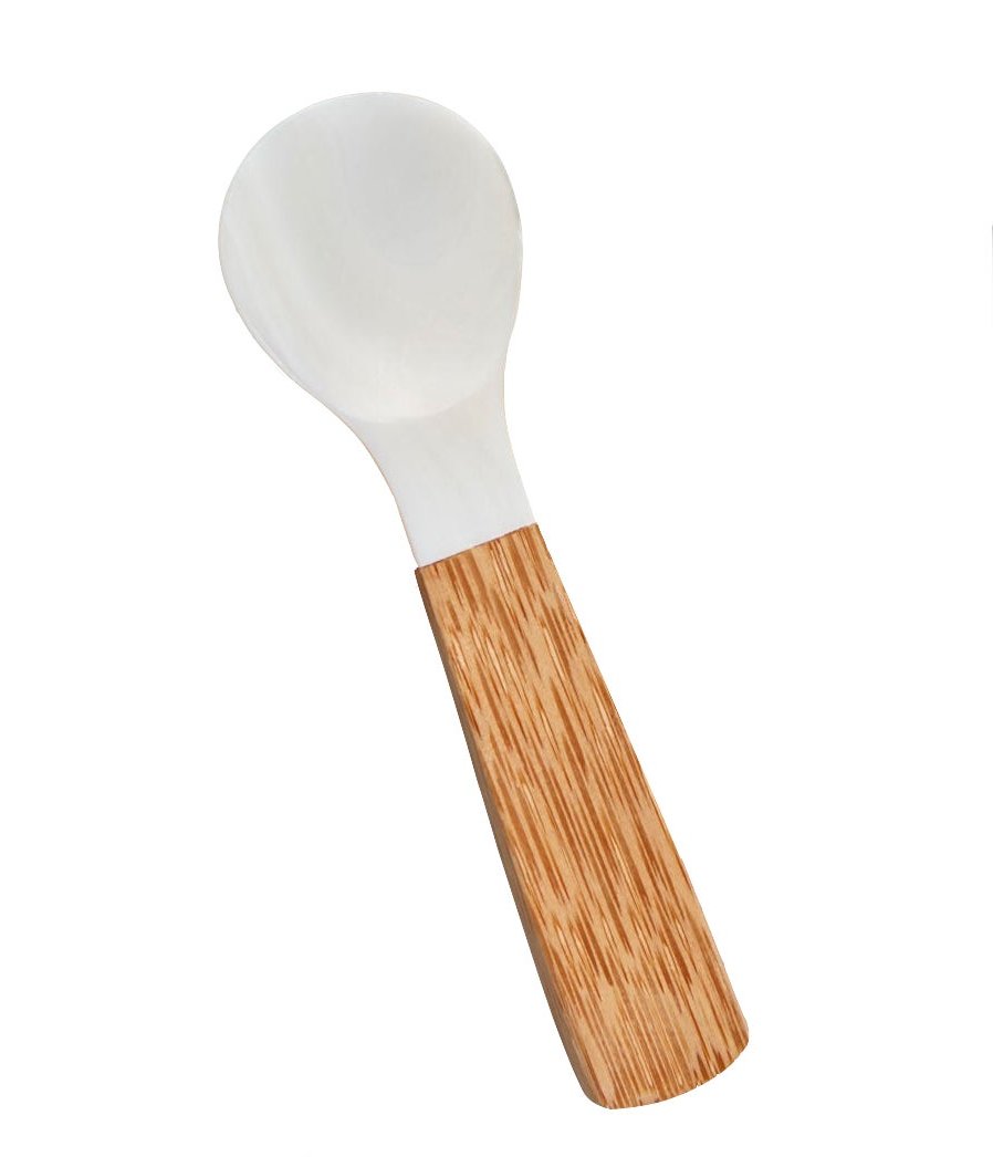 The Be Home Shell and Bamboo Serving Collection features a white plastic spoon with a wide bowl and a natural-grain bamboo handle, highlighting organic beauty in every detail.