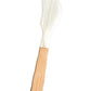 The Be Home Shell and Bamboo Serving Collection features an ethically crafted spreader knife with a light wooden handle and smooth white curved blade, showcasing organic beauty against a plain white background.