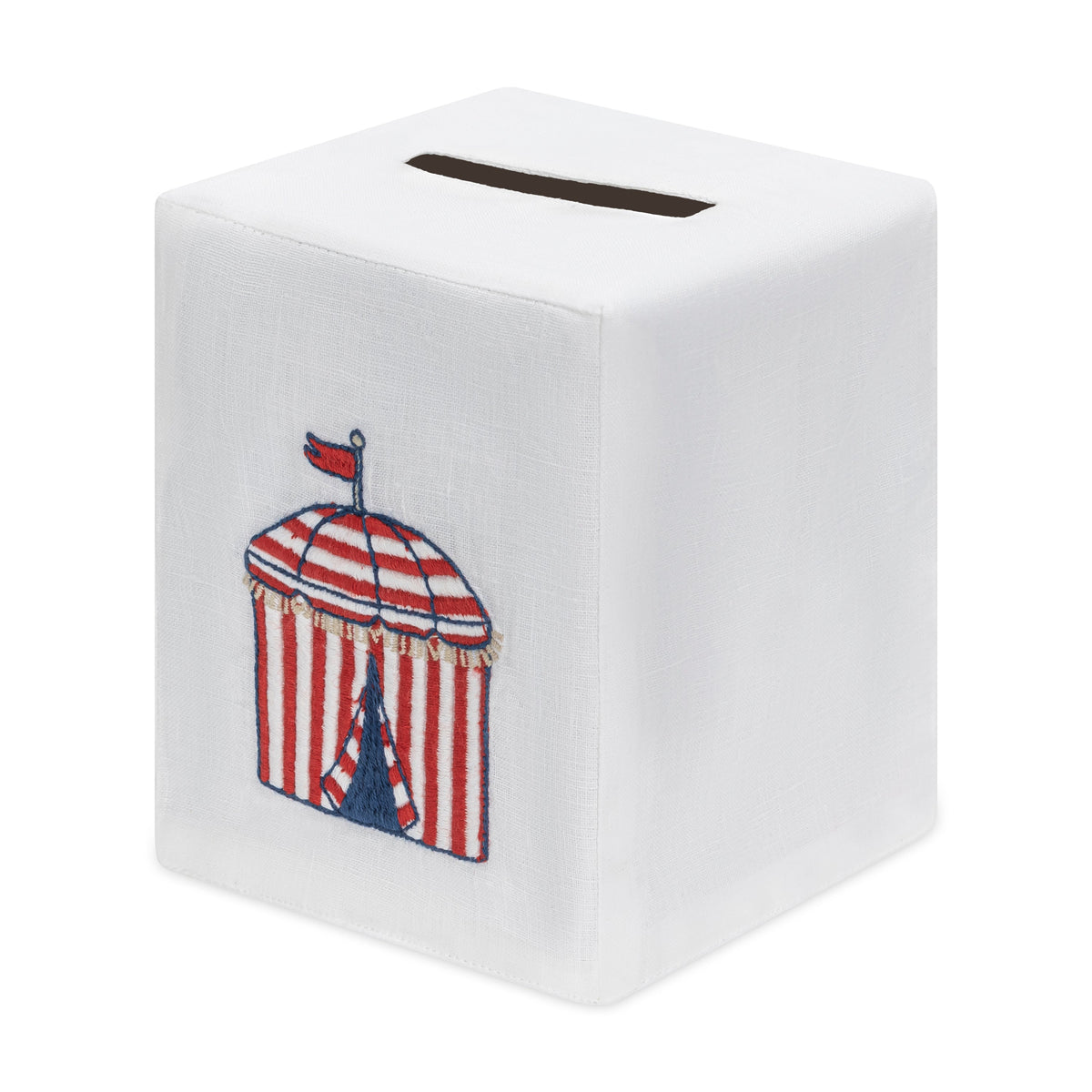 Haute Home’s Beach Cabana Bath Collection features a white, cube-shaped tissue box cover crafted from premium Italian linen and adorned with an embroidered red and white striped cabana topped with a small flag.