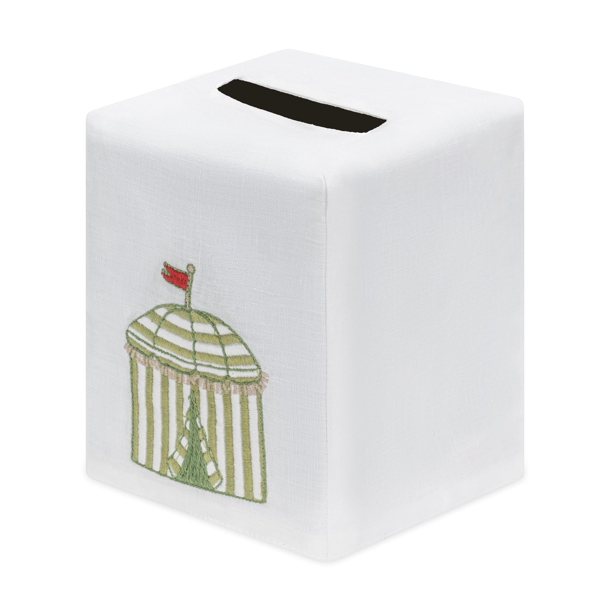The Beach Cabana Bath Collection by Haute Home features a white tissue box cover crafted from premium Italian linen, embroidered with a green and white cabana topped with a small red flag, and designed with an opening at the top for tissues.