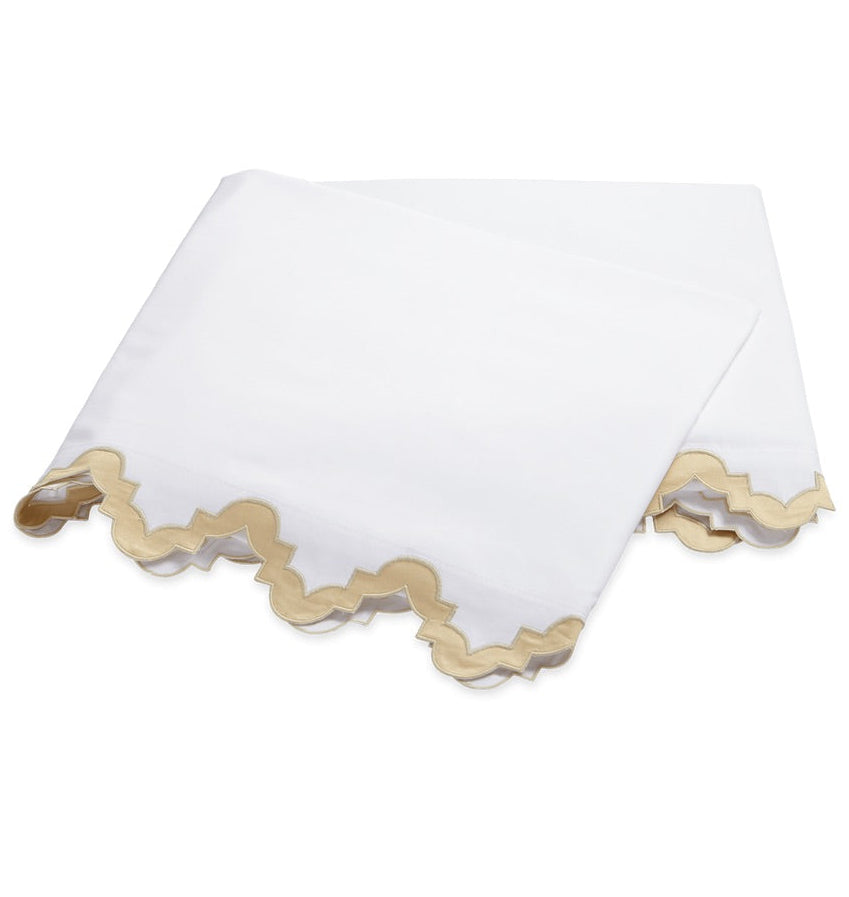 Two white 600 thread count Egyptian cotton percale pillowcases from the Aziza Bedding Collection, Champagne, featuring metallic champagne scalloped edges.