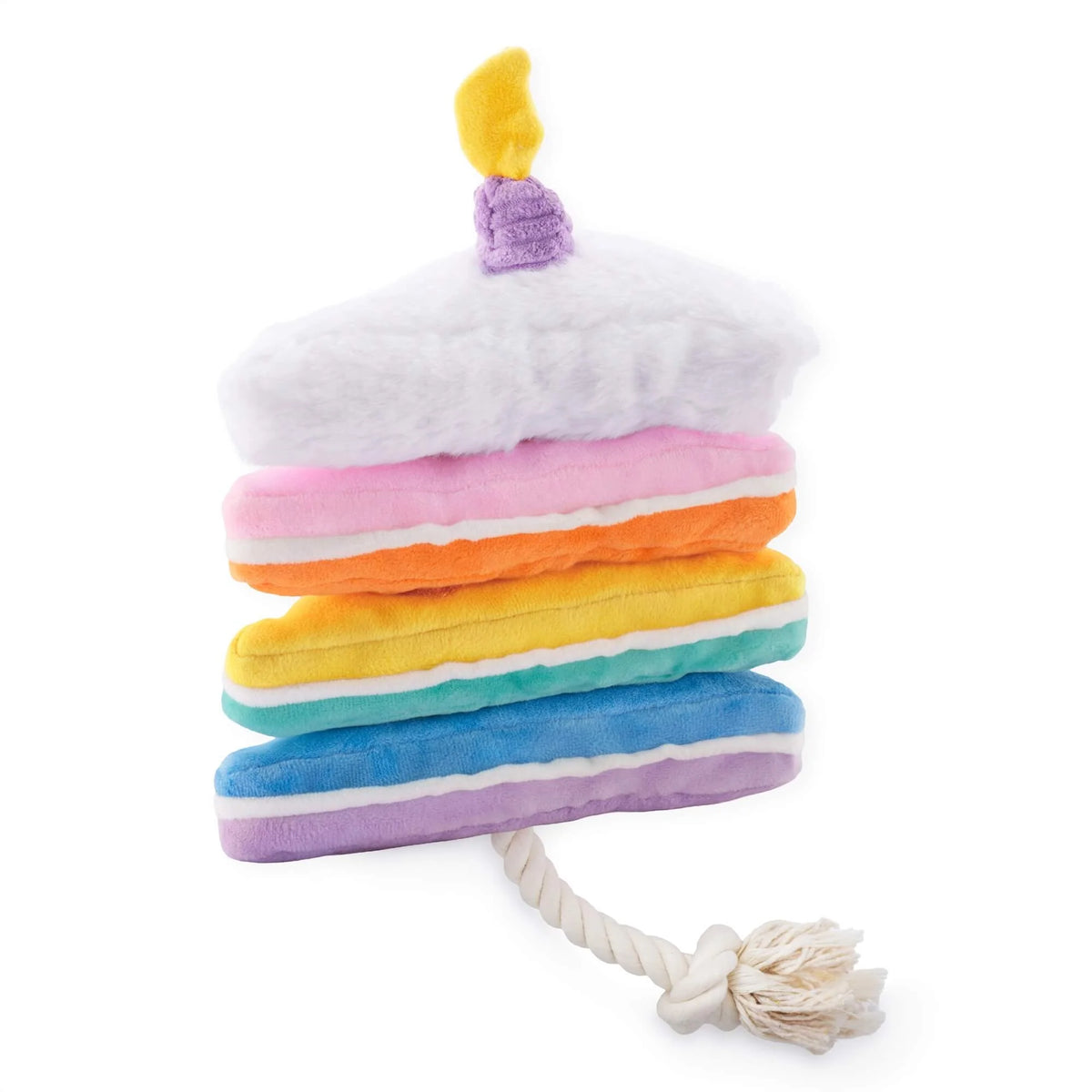 The Foggy Dog Birthday Cake Interactive Snuffle Dog Toy is shaped like a vibrant rainbow layer cake complete with a yellow candle on top and a sturdy rope tail at the bottom, making it perfect for playful pups who enjoy both snuggling and tug-of-war games.