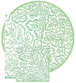 Caspari's Block Print Leaves Collection features round and rectangular eco-friendly napkins with a green leafy pattern on white, ideal for stylish, sustainable gatherings.