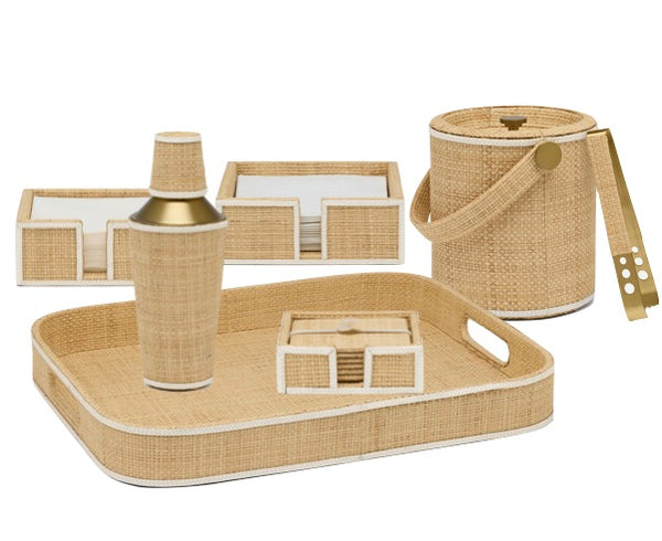 From Blue Pheasant's Gable Bar Collection in Natural/White, this set features beige woven rattan and raffia bar accessories—tray, cocktail shaker, ice bucket with handle, two trays, and coaster holder—all with subtle leather trims.