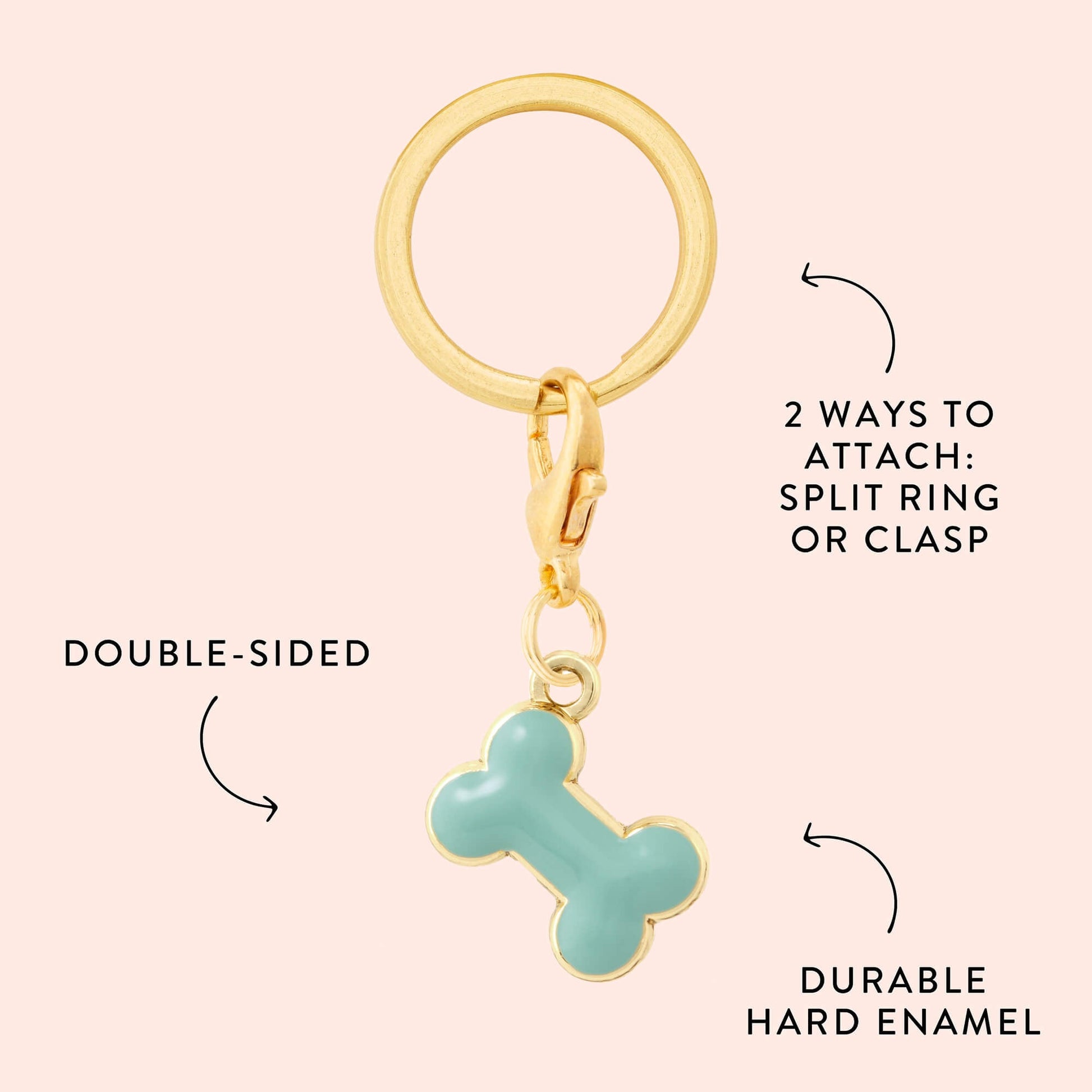 The Foggy Dog Blue Bone Collar Charm is a gold keyring with a blue enamel, bone-shaped charm. It features a split ring, lobster clasp, and double-sided durable construction—perfect for your pet's collar.