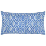 The Ravi Azure Bolster by John Robshaw is a rectangular pillow with a blue and white hexagonal pattern, each hexagon adorned with floral motifs and subtle embroidered details for extra texture.