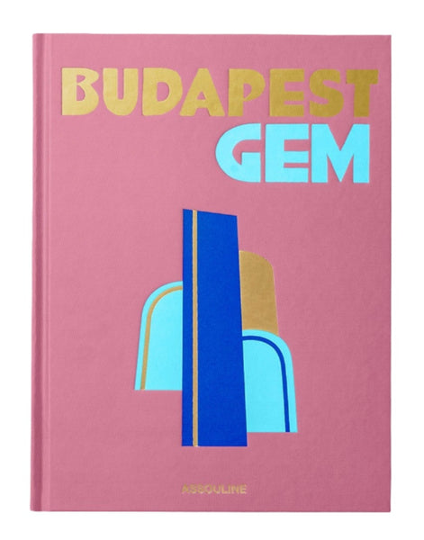 The cover of Assouline's "Budapest Gem" showcases abstract geometric shapes in blue and gold set against a pink backdrop, subtly evoking the elegance of Buda Castle.