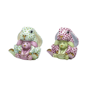 Herend Bunny and Lovey by Herend features two hand-painted ceramic bunny figurines, each holding a smaller bunny, in green-pink and red-green sets with gold accents on their paws and ears.