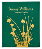 The Bunny Williams: A Life In The Garden, Leather Bound by Graphic Image features a green cover with a gold floral silhouette, reflecting Bunny Williams’ love of gardens and elegant design inspired by an eighteenth-century manor house.