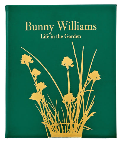 The Bunny Williams: A Life In The Garden, Leather Bound by Graphic Image features a green cover with a gold floral silhouette, reflecting Bunny Williams’ love of gardens and elegant design inspired by an eighteenth-century manor house.
