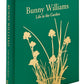 The "Bunny Williams: A Life In The Garden" leather-bound book by Graphic Image features yellow floral designs and embossed text, celebrating gardens inspired by Bunny Williams’s eighteenth-century manor.