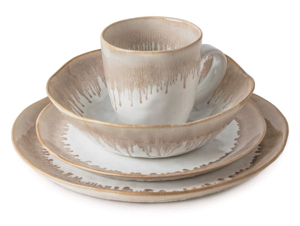 A Simon Pearce Burlington Bluff Collection cup and saucer set with a neutral color gradient design, displayed with a matching pinch-pot designs plate.