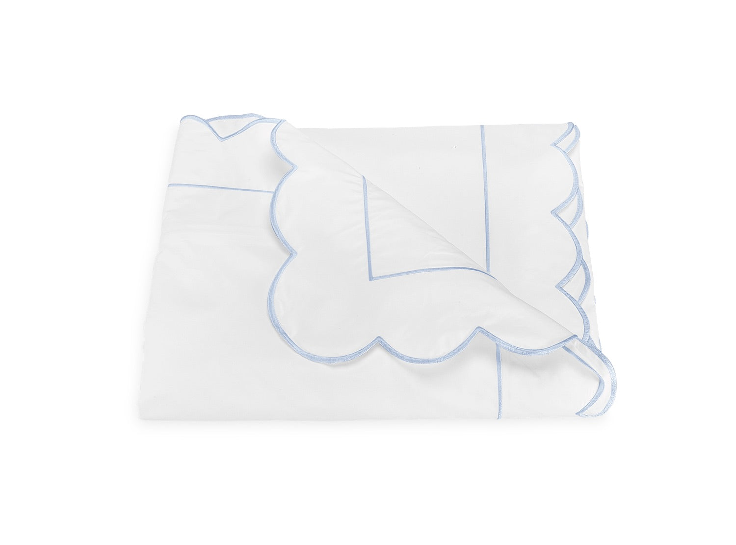 Butterfield Bedding Collection blanket by Matouk, featuring scallop-edged detailing and light blue trim, displayed folded on a white background.