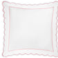 Butterfield Bedding Collection square pillow by Matouk, featuring crisp white fabric with scalloped edges and a delicate pink border reminiscent of luxurious Egyptian cotton sheet detailing, displayed from above against a white background.