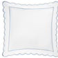 Square white pillow from the Matouk Butterfield Bedding Collection, featuring delicate scalloped edges and a fine blue border, viewed from above against a plain background. Designed to pair perfectly with Egyptian cotton sheets, this pillow showcases exquisite scallop detailing that brings an elegant touch to any bedding ensemble.