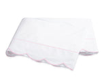 Folded white percale sheeting from the Matouk Butterfield Bedding Collection, featuring a scalloped pink trim along one edge, displayed on a plain white background.