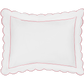 The Matouk Butterfield Bedding Collection, Azalea, features a white pillow with scalloped edges and a slim red border, made from 500 thread count Egyptian cotton percale, displayed on a transparent background.