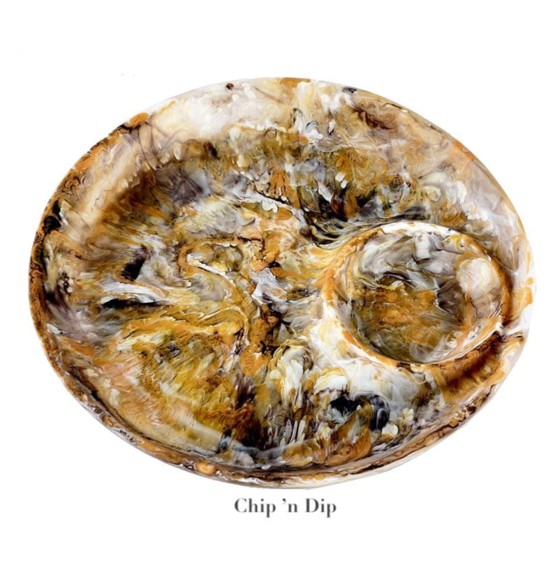 The Nashi Home Mocha Resin Serveware Collection includes a round, marbled chip and dip platter with a central dip section—food safe and ideal for serving or as stylish home decor.
