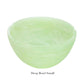 A small, light green bowl from the Nashi Home Mint Resin Serveware Collection features a smooth, rounded shape and shatter-resistant design—perfect for stylish home decor and everyday use.