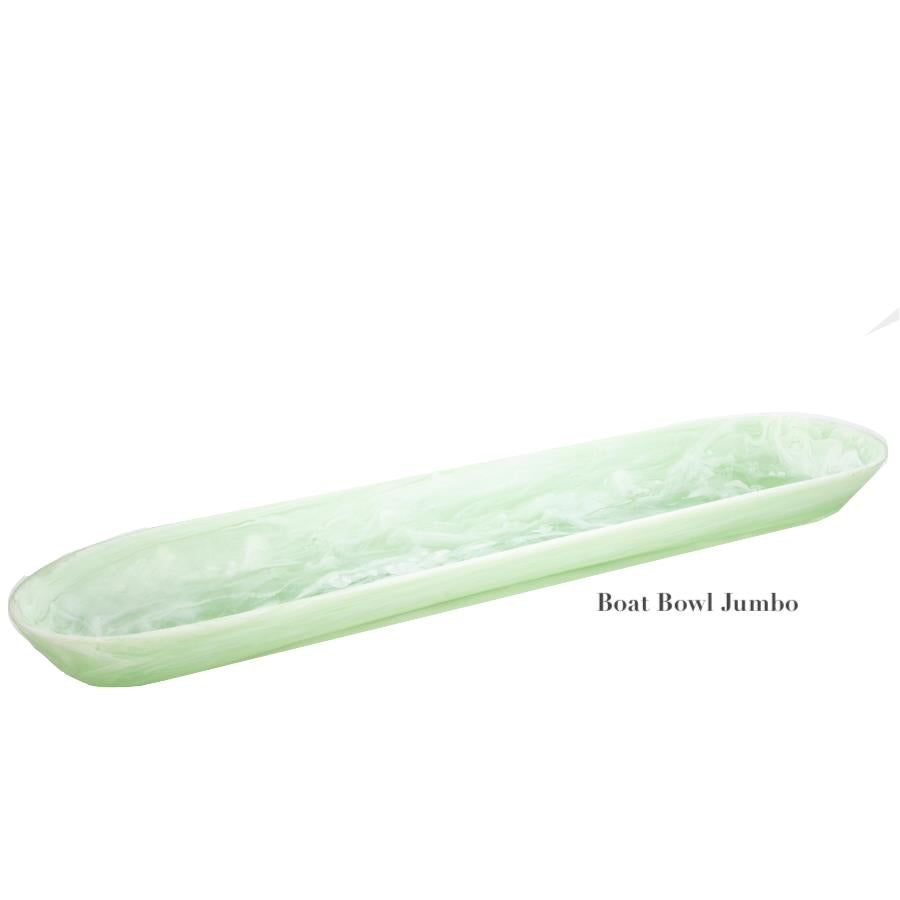 A long, oval-shaped light green marbled bowl from the Nashi Home Mint Resin Serveware Collection—shatter resistant and stylish, ideal for home decor.