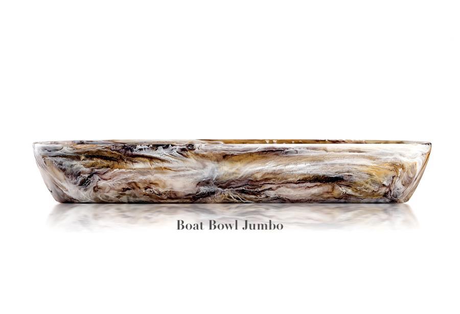 A large oval bowl from Nashi Home’s Mocha Resin Serveware Collection features a marbled brown, black, and white design. Called "Boat Bowl Jumbo," this food-safe piece doubles as striking home decor. Displayed on a white background.