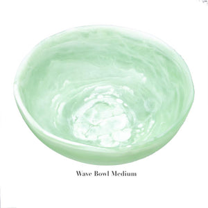 The Mint Resin Serveware Collection by Nashi Home features a medium, light green marbled bowl made from shatter-resistant resin, styled as "Wave Bowl Medium"—a chic accent for any home decor.