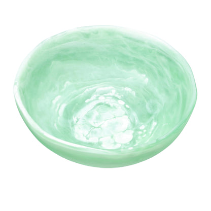 The Nashi Home Mint Resin Serveware Collection bowl features a light green marbled design and is photographed on a white background—an elegant, shatter-resistant addition to your home decor.