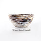 A small glass-look bowl with swirling brown, black, and white patterns from the Mocha Resin Serveware Collection by Nashi Home—a stunning, food-safe piece perfect for decor or versatile serving.