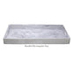 Part of the Nashi Home White Resin Serveware Collection, this handled rectangular tray features a white marbled surface and side handles, adding a chic accent to your home decor.