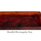 A rectangular, marbled reddish-brown tray from the Tortoise Resin Serveware Collection by Nashi Home, made of shatter-resistant resin with raised edges—a stylish decor accent for your home. Shown on a white background.