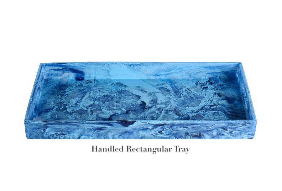 A blue marbled rectangular tray with side handles, part of the Denim Resin Serveware Collection by Nashi Home. Made from shatter-resistant resin—ideal for stylish home decor. Labeled "Handled Rectangular Tray" below the image.