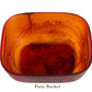 A square, translucent amber Tortoise Resin Serveware Collection party bucket by Nashi Home, with rounded edges and side handles—shatter resistant and stylish for home decor.