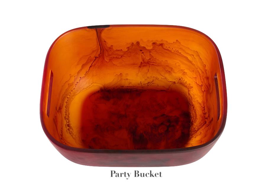 A square, translucent amber Tortoise Resin Serveware Collection party bucket by Nashi Home, with rounded edges and side handles—shatter resistant and stylish for home decor.