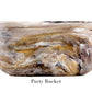 The Mocha Resin Serveware Collection by Nashi Home features a large, marbled bowl with swirling brown, beige, and white patterns—labeled "Party Bucket"—ideal for stylish home decor and safe for serving food at gatherings.