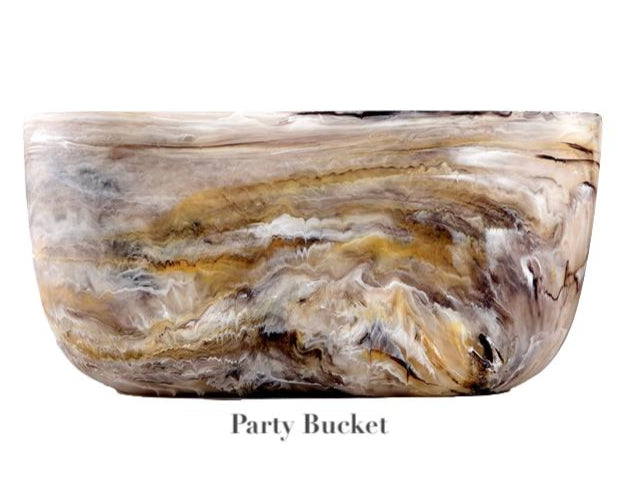 The Mocha Resin Serveware Collection by Nashi Home features a large, marbled bowl with swirling brown, beige, and white patterns—labeled "Party Bucket"—ideal for stylish home decor and safe for serving food at gatherings.