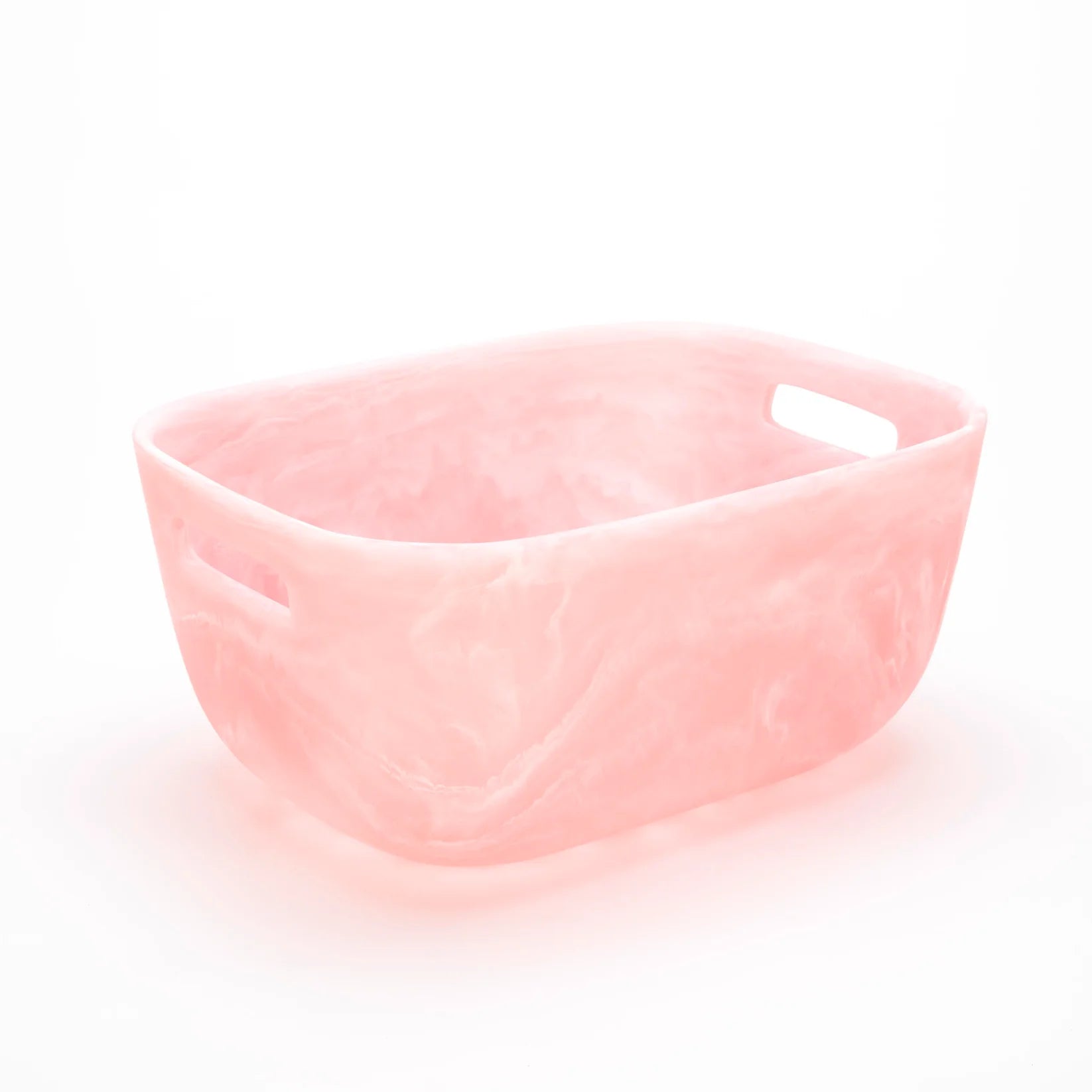A rectangular Pink Swirl Collection container by Nashi Home, featuring translucent pink color, rounded corners, and side handles—ideal as a serving piece or colorful home accent. Displayed on a white background.