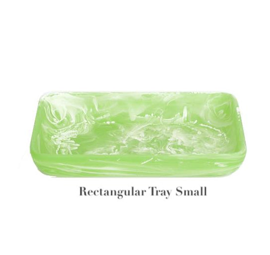 The "Mint Resin Serveware Collection" by Nashi Home features a small, rectangular, light green marbled tray made from shatter-resistant resin—a stylish addition to your decor. Labeled "Rectangular Tray Small" below the tray.