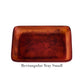 A small rectangular tray from Nashi Home’s Tortoise Resin Serveware Collection features a marbled reddish-brown pattern and shatter-resistant resin—ideal for stylish home decor. Labeled "Rectangular Tray Small" below the tray.